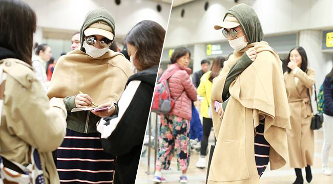 张馨予帽子叠加“全副武装” 成功吸引路人目光