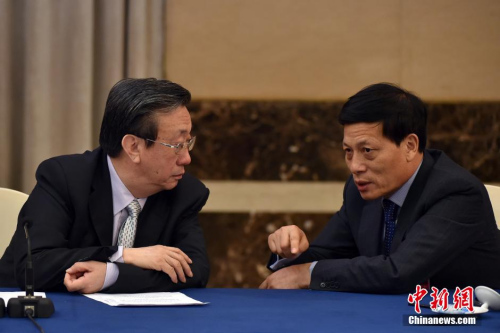 資料圖：郭庚茂（左）與謝伏瞻（右）