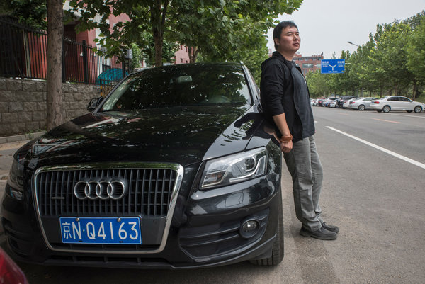 美媒看北京摇号:车牌争夺激烈 催生地下黑市